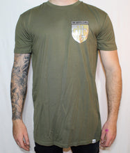 Load image into Gallery viewer, Olive green tall tee with gold and silver shield print