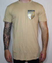 Load image into Gallery viewer, Beige tall tee with gold and silver shield print