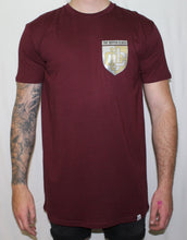 Load image into Gallery viewer, Maroon tall tee with gold and silver shield print