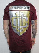 Load image into Gallery viewer, Maroon tall tee with gold and silver shield print