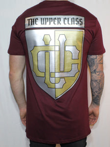Maroon tall tee with gold and silver shield print