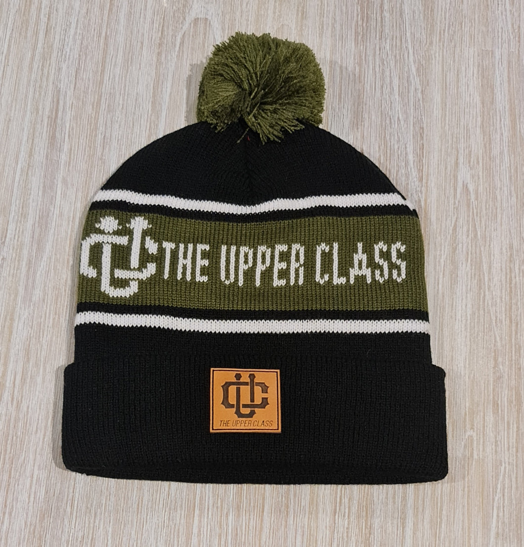 olive green, white and black beanie
